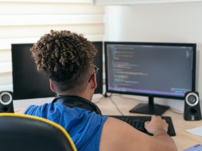 A website/software developer busy coding in his studio