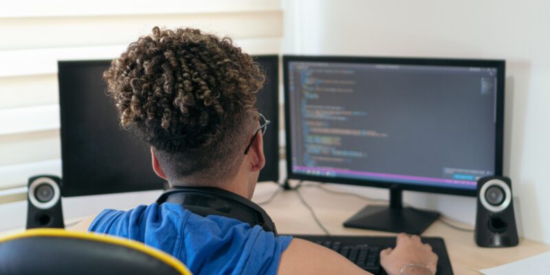 A website/software developer busy coding in his studio